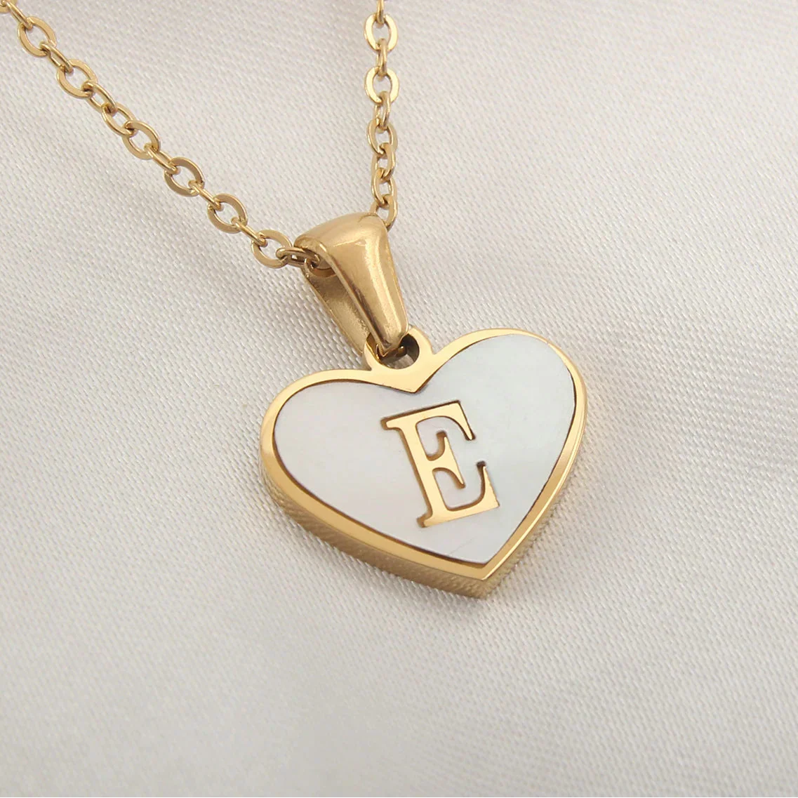 White heart pendant necklace initial e