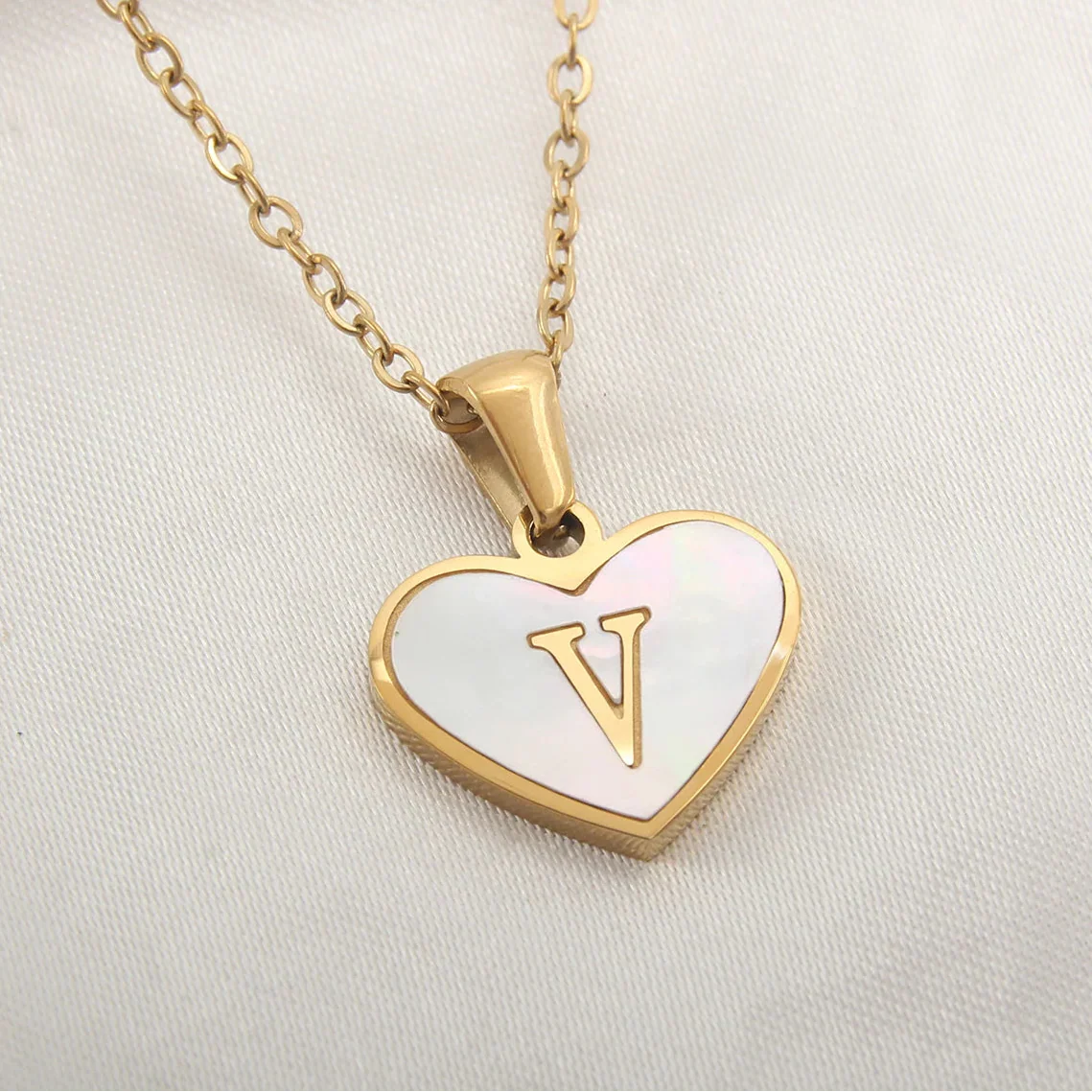 White heart pendant necklace initial v