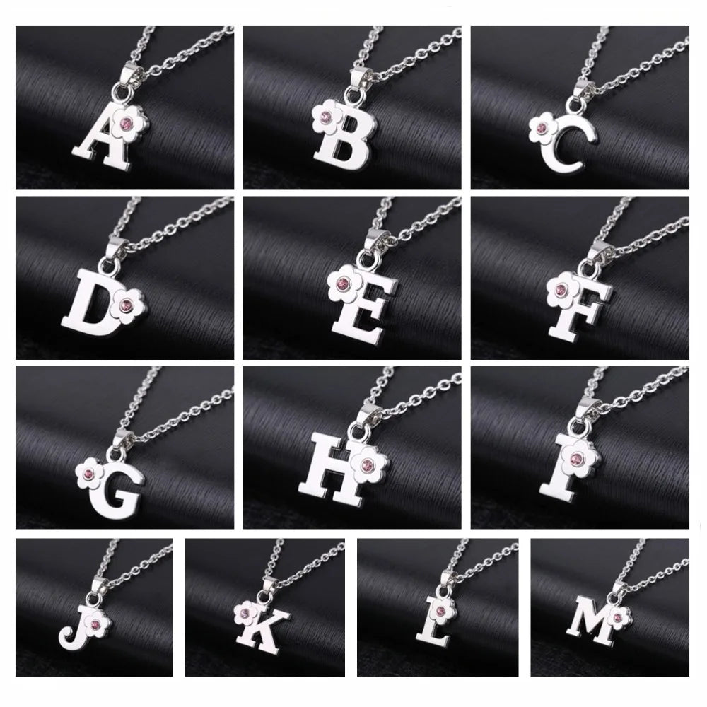 Necklace with initial and flower pendant