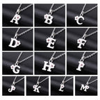 Necklace with initial and flower pendant