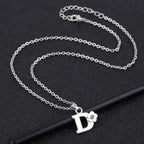 Necklace with initial and flower pendant d