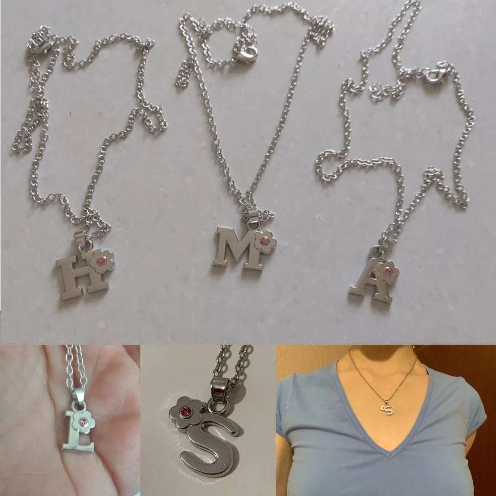 Necklace with initial and flower pendant