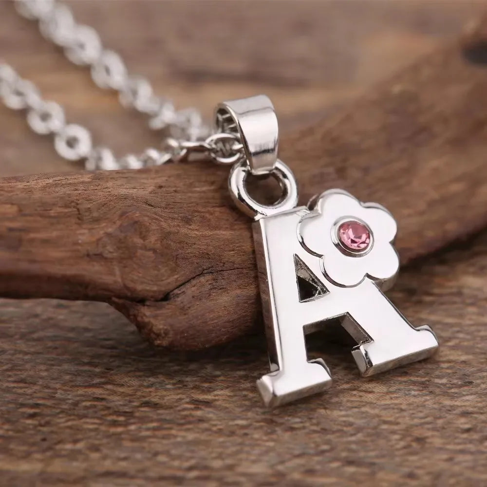 Necklace with initial and flower pendant a