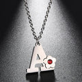Necklace with initial and flower pendant 