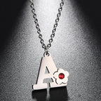 Necklace with initial and flower pendant 