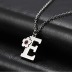 Necklace with initial and flower pendant e