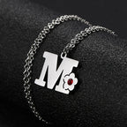 Necklace with initial and flower pendant m