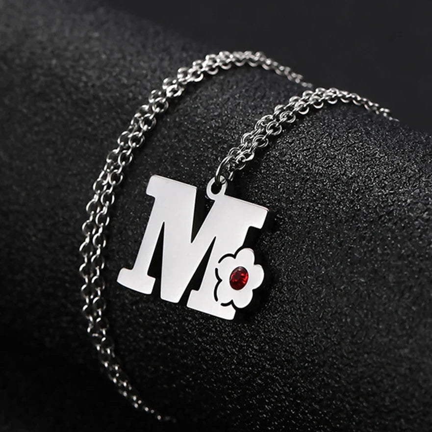 Necklace with initial and flower pendant m