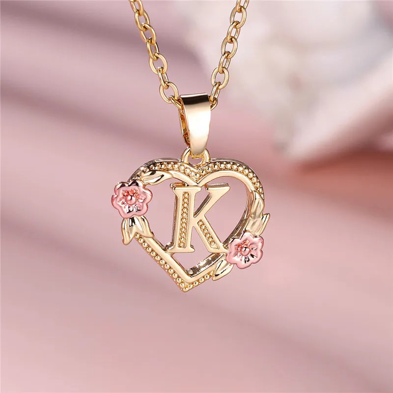 Heart and flowers initial pendant necklace k