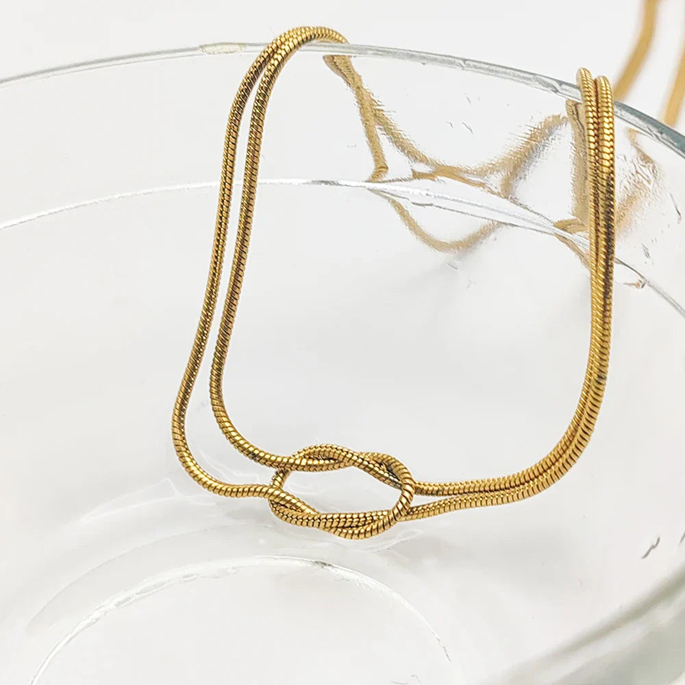 Necklace with Minimalist Bow Pendant in gold