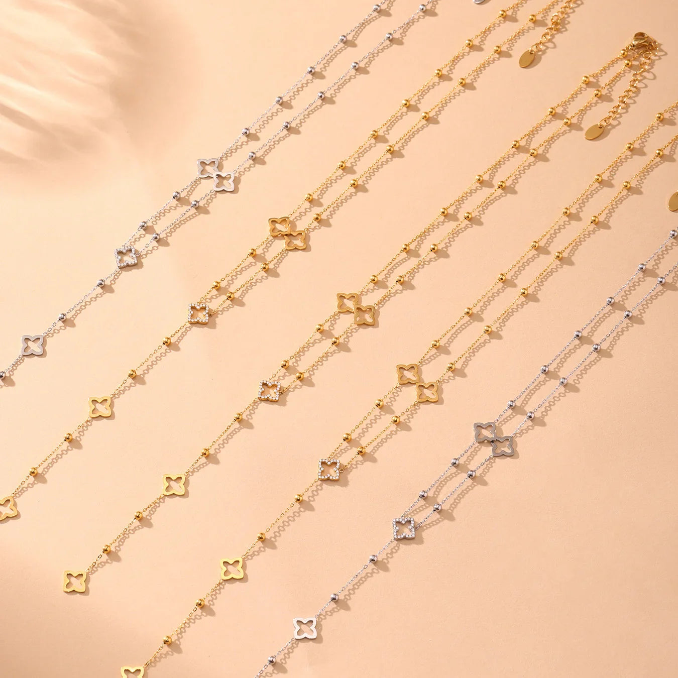 Long Necklace with 4-Leaf Clover and Zircon Pendants gold