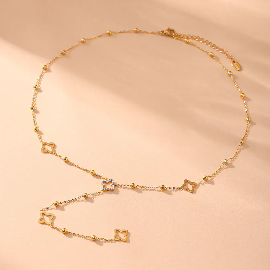 Long Necklace with 4-Leaf Clover and Zircon Pendants gold