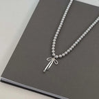 Pendant Necklace with Grey Pearls and Bow Tie 