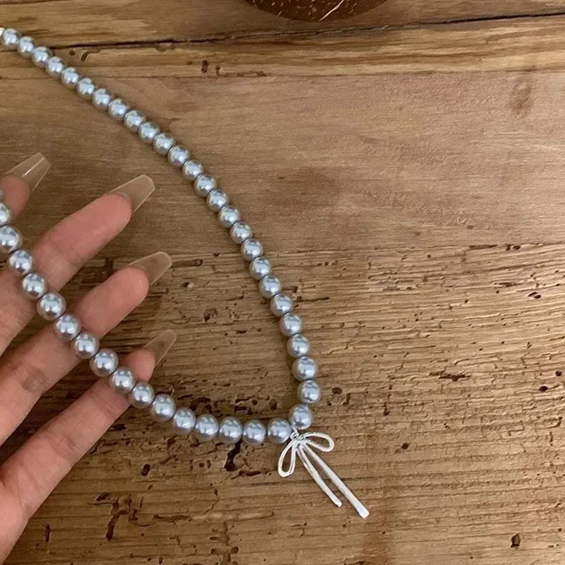 Pendant Necklace with Grey Pearls and Bow Tie 