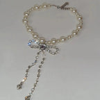 Choker necklace with rhinestone bow pendant