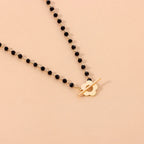 Floral Pendant Choker Necklace in Black and Gold