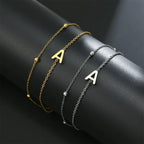 Double initial bracelet in gold and silver  a