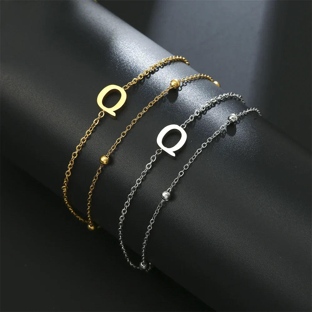 Double initial bracelet in gold and silver  q