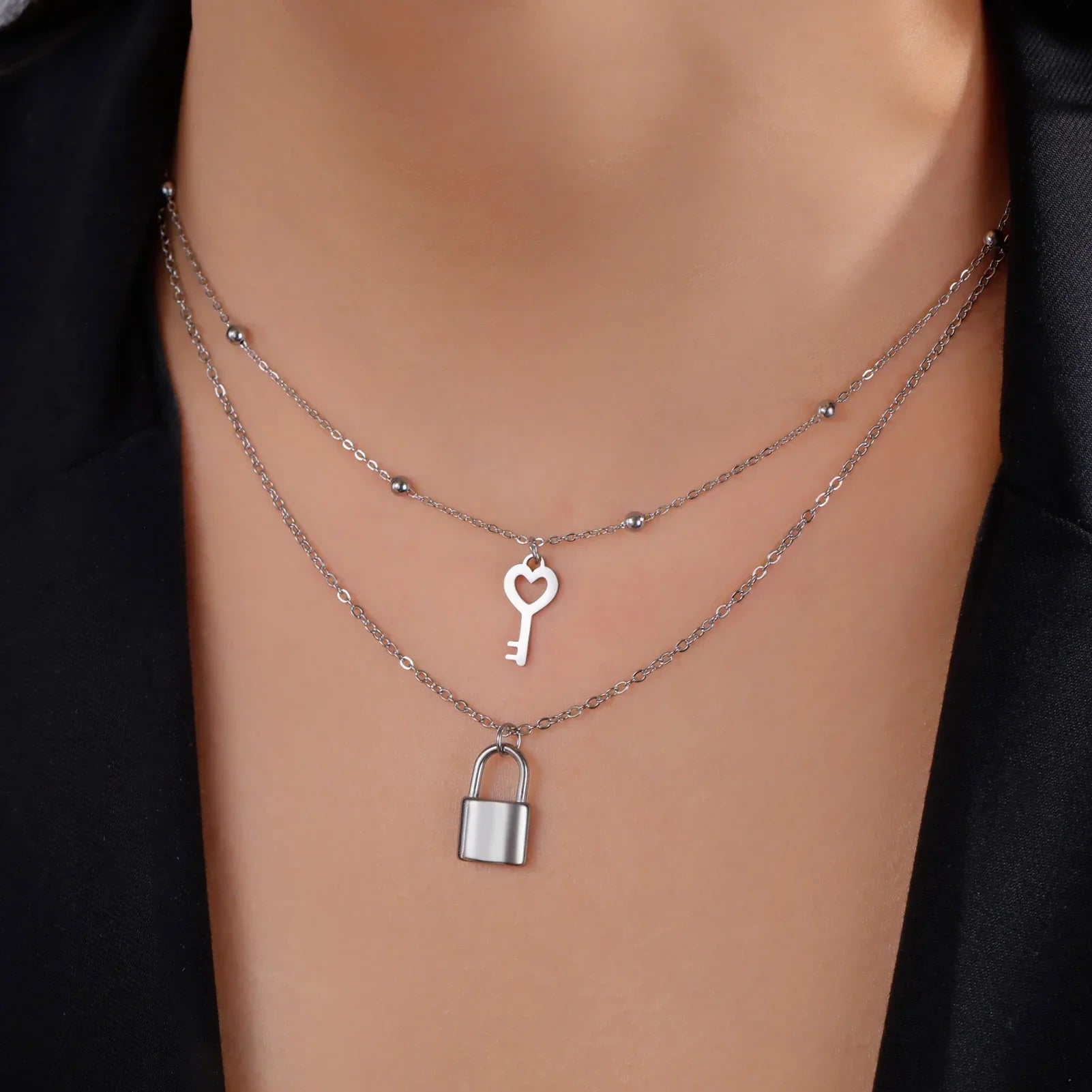 Double necklace with silver key and lock pendant