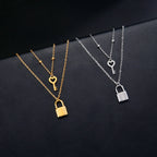 Double necklace with gold key and lock pendant