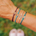 Set of 4 Rope Bracelets with Round Mountain Pendant